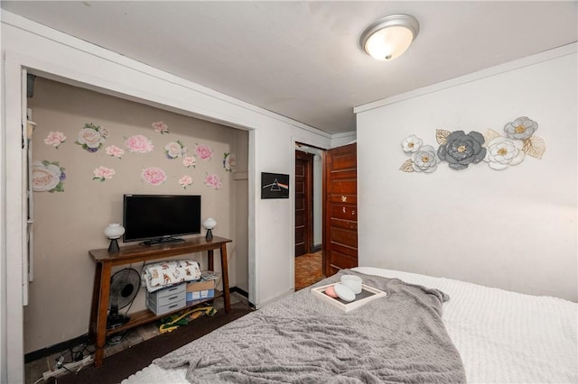 bedroom with carpet floors and baseboards