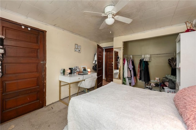 carpeted bedroom with a ceiling fan