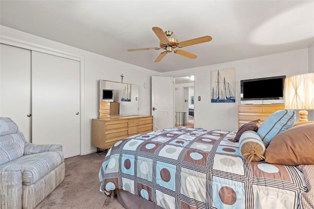 bedroom featuring carpet floors, a closet, and a ceiling fan