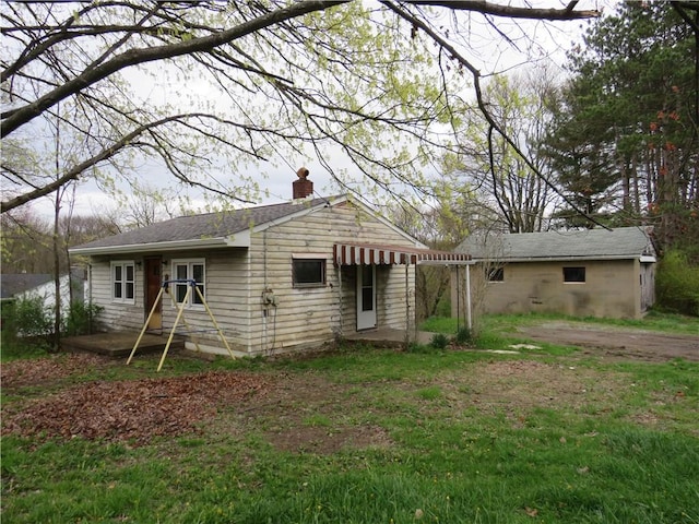 1606 Oneida Valley Rd, Concord Twp, PA 16025 - rear view of house with a chimney