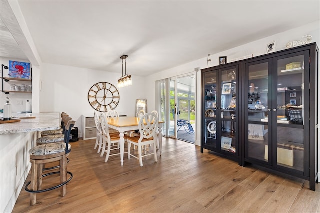 dining area with light wood finished floors
