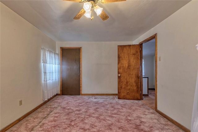 unfurnished bedroom with carpet, baseboards, and ceiling fan