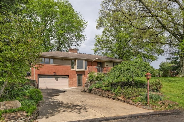 view of front of home featuring an attached garage, driveway, a chimney, brick siding, and a front yard