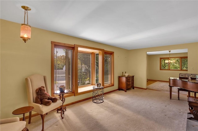 sitting room with carpet flooring and baseboards