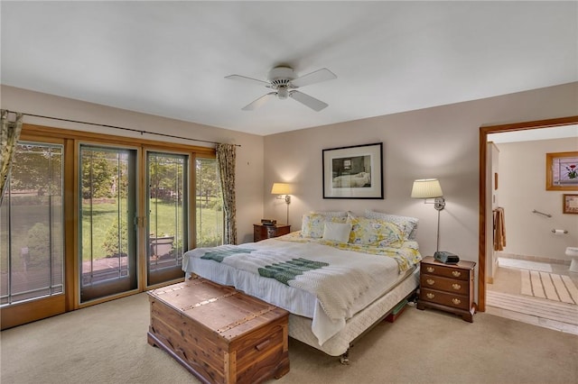 bedroom featuring light colored carpet, access to exterior, connected bathroom, and a ceiling fan