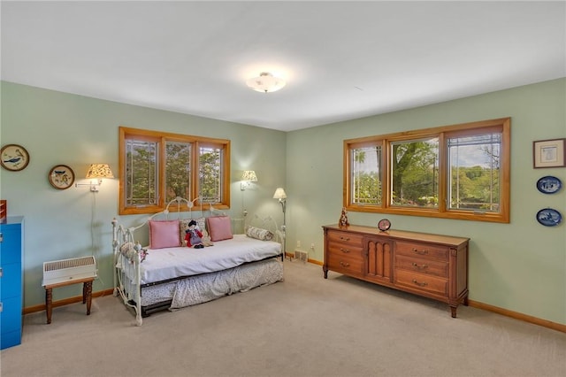carpeted bedroom with baseboards