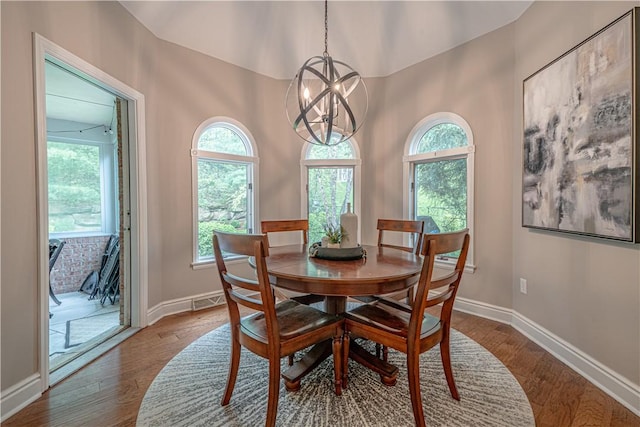 dining space featuring plenty of natural light and a chandelier