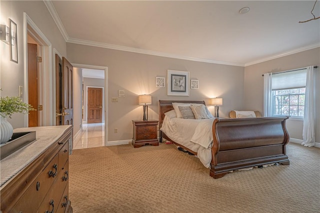bedroom with crown molding, light colored carpet, and baseboards