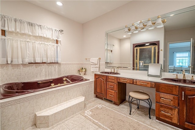 full bath featuring double vanity, a garden tub, recessed lighting, and tile patterned flooring
