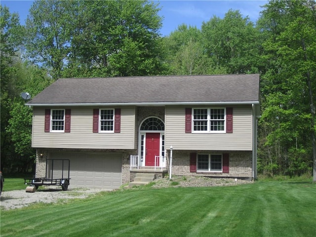 104MAPLEWOODAVE Maplewood Ave, Carmichaels/Cumblnd, PA 15320 - raised ranch featuring an attached garage, brick siding, a front yard, and driveway