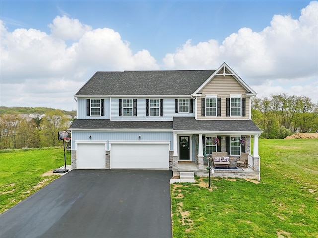 view of front of home with covered porch, a shingled roof, asphalt driveway, and a garage