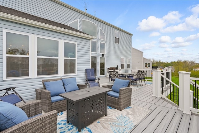 wooden terrace with outdoor dining area and an outdoor living space