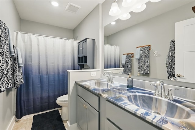 bathroom featuring toilet, tile patterned floors, double vanity, recessed lighting, and a shower with curtain