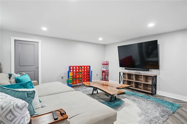 living room with recessed lighting and baseboards