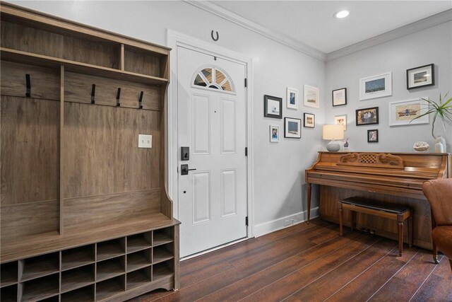 mudroom with baseboards, dark wood-style flooring, crown molding, and recessed lighting