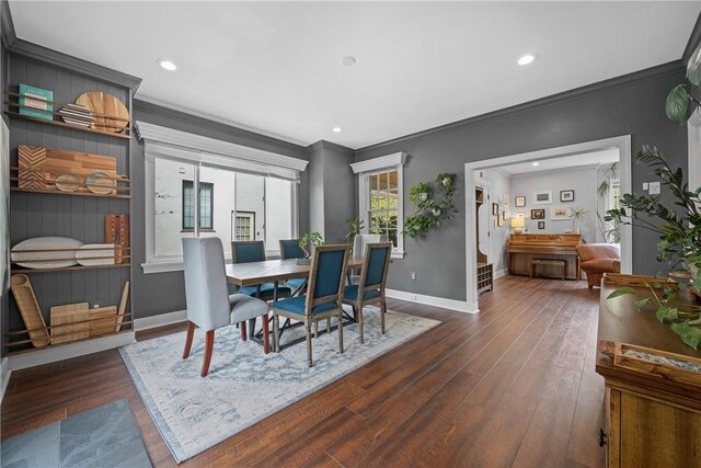 dining space featuring hardwood / wood-style floors, crown molding, baseboards, and recessed lighting
