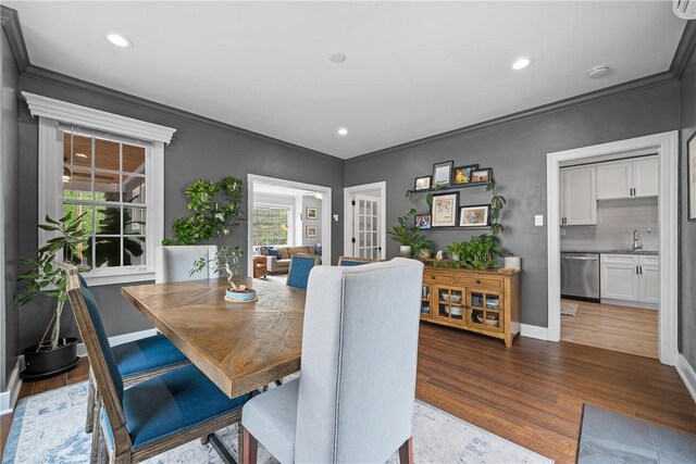 dining room featuring ornamental molding, dark wood-style floors, recessed lighting, baseboards, and french doors