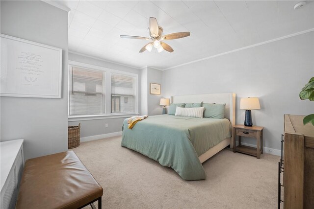 bedroom with light carpet, baseboards, a ceiling fan, and ornamental molding