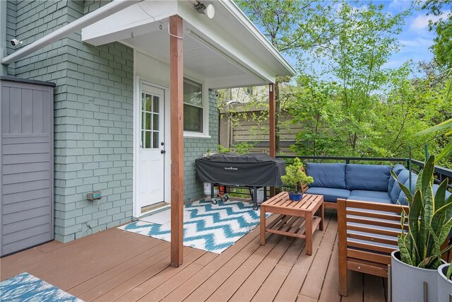 deck with outdoor lounge area and grilling area