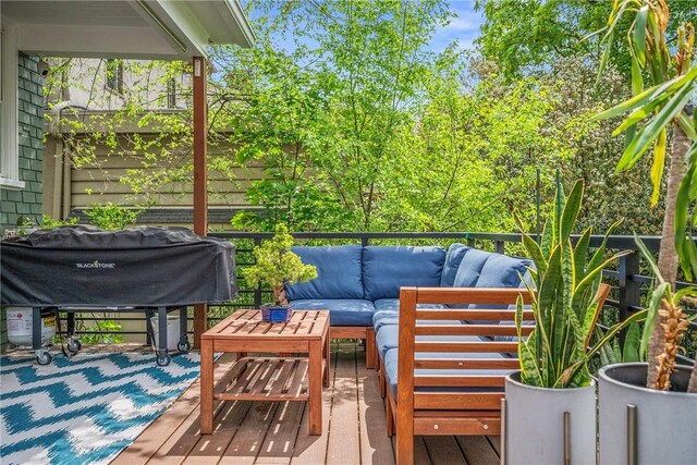 wooden terrace featuring an outdoor living space