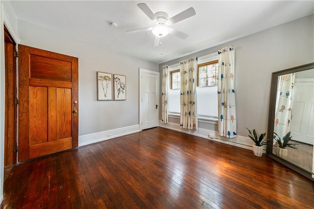 entrance foyer with wood-type flooring, ceiling fan, and baseboards