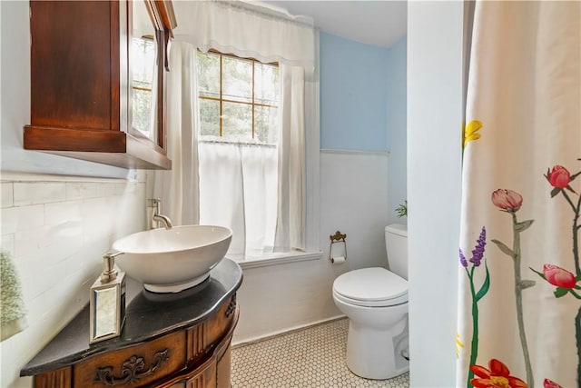 full bath with toilet and vanity