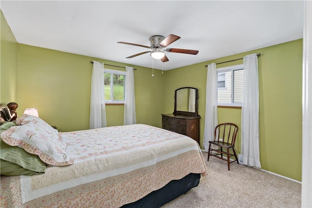 bedroom featuring carpet, baseboards, and ceiling fan