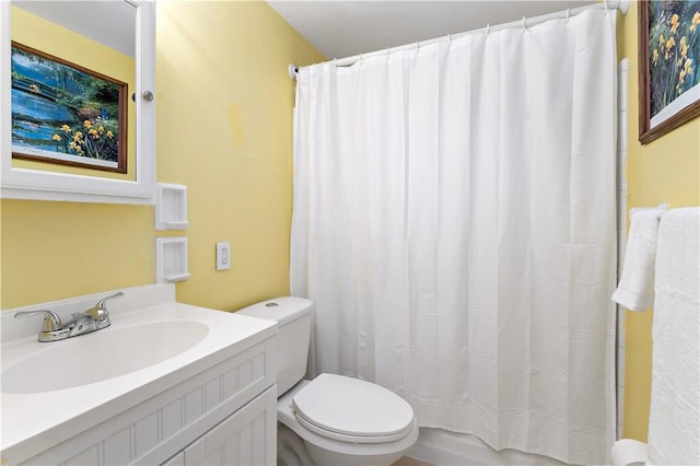 full bathroom featuring toilet and vanity