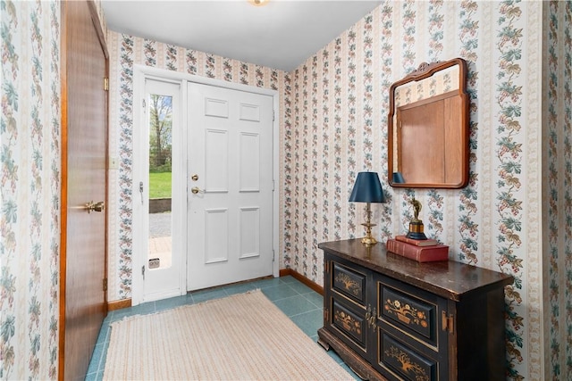 108 Crestview Dr, Evans City Boro, PA 16033 - entrance foyer featuring baseboards, dark tile patterned flooring, and wallpapered walls