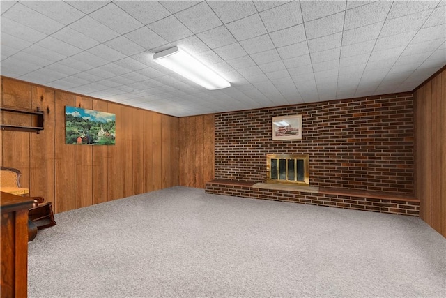 108 Crestview Dr, Evans City Boro, PA 16033 - finished below grade area with a brick fireplace, carpet floors, and wooden walls