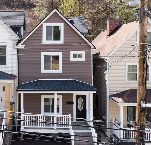 232 57th St, Lawrenceville, PA 15201 - traditional style home featuring a porch and roof with shingles