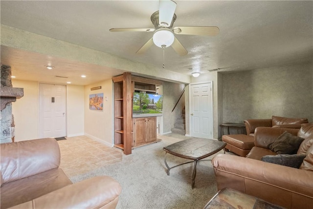 living area with stairs, baseboards, ceiling fan, and recessed lighting
