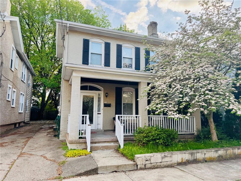 714 Washington St, Sewickley, PA 15143 - traditional style home featuring a porch, brick siding, and a chimney
