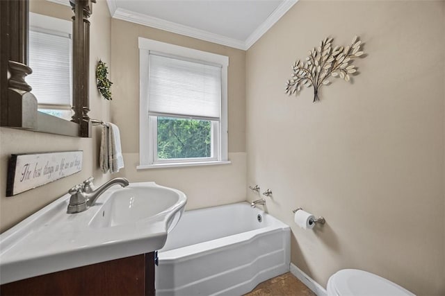full bath with ornamental molding, toilet, vanity, and a garden tub