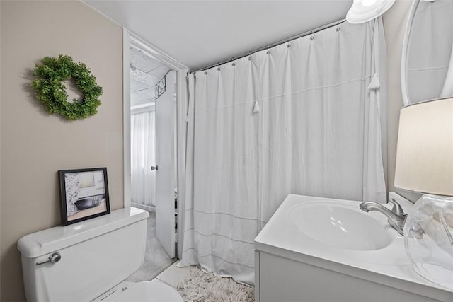 full bathroom featuring vanity, toilet, and marble finish flooring