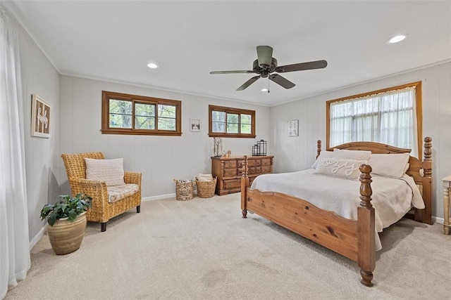 carpeted bedroom featuring ornamental molding, a ceiling fan, recessed lighting, and baseboards