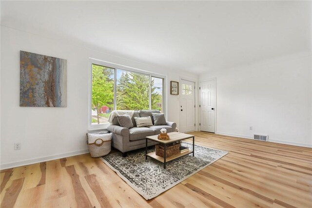 living room featuring wood finished floors and baseboards