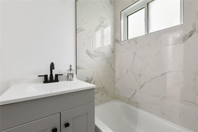bathroom with vanity and shower / bathtub combination
