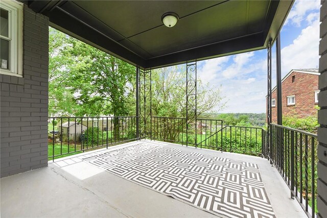view of patio featuring a balcony