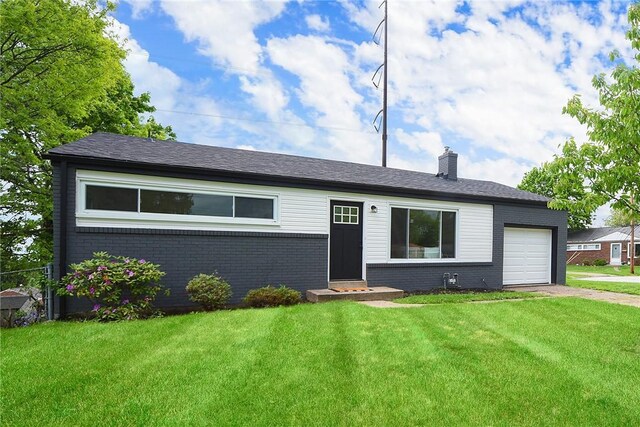 ranch-style home featuring brick siding, a garage, driveway, and a front lawn
