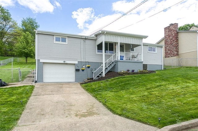 1104 Bennett Ave, Jeannette, PA 15644 - view of front of house featuring a porch, a garage, concrete driveway, a gate, and stairway
