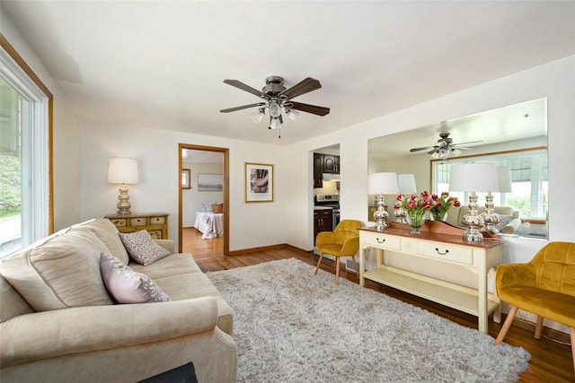 1104 Bennett Ave, Jeannette, PA 15644 - living room with ceiling fan, wood finished floors, and baseboards