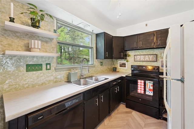 kitchen with black appliances, open shelves, a sink, light countertops, and decorative backsplash
