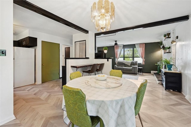 dining area with a ceiling fan, beam ceiling, a chandelier, and baseboards