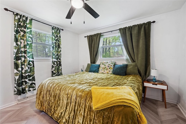 bedroom with baseboards and ceiling fan