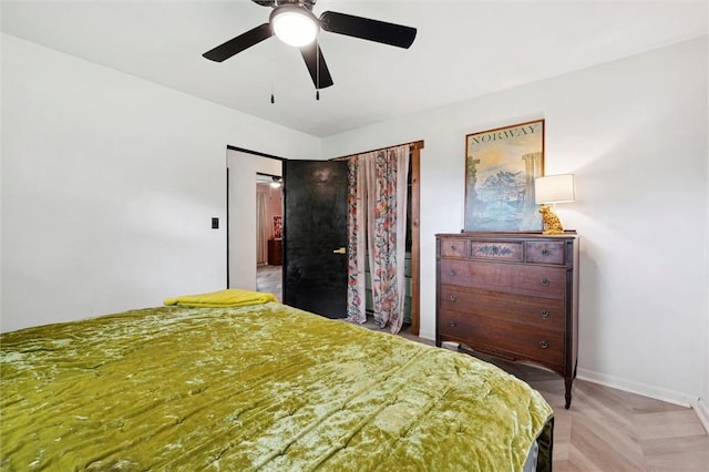 bedroom with baseboards and ceiling fan