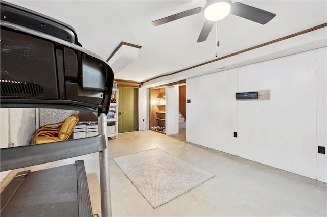 misc room with finished concrete flooring and a ceiling fan