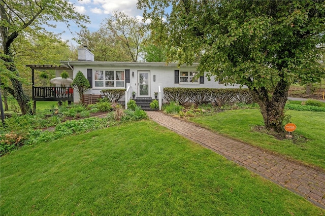 ranch-style house with a chimney, a front lawn, a pergola, and a wooden deck