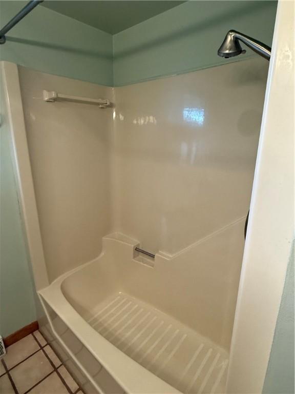 full bathroom featuring tile patterned flooring
