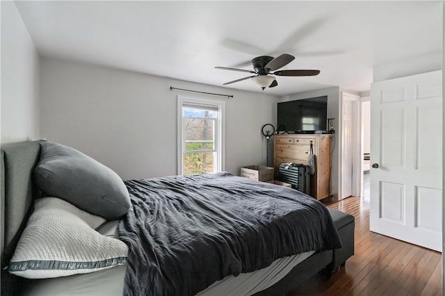bedroom featuring hardwood / wood-style floors and ceiling fan